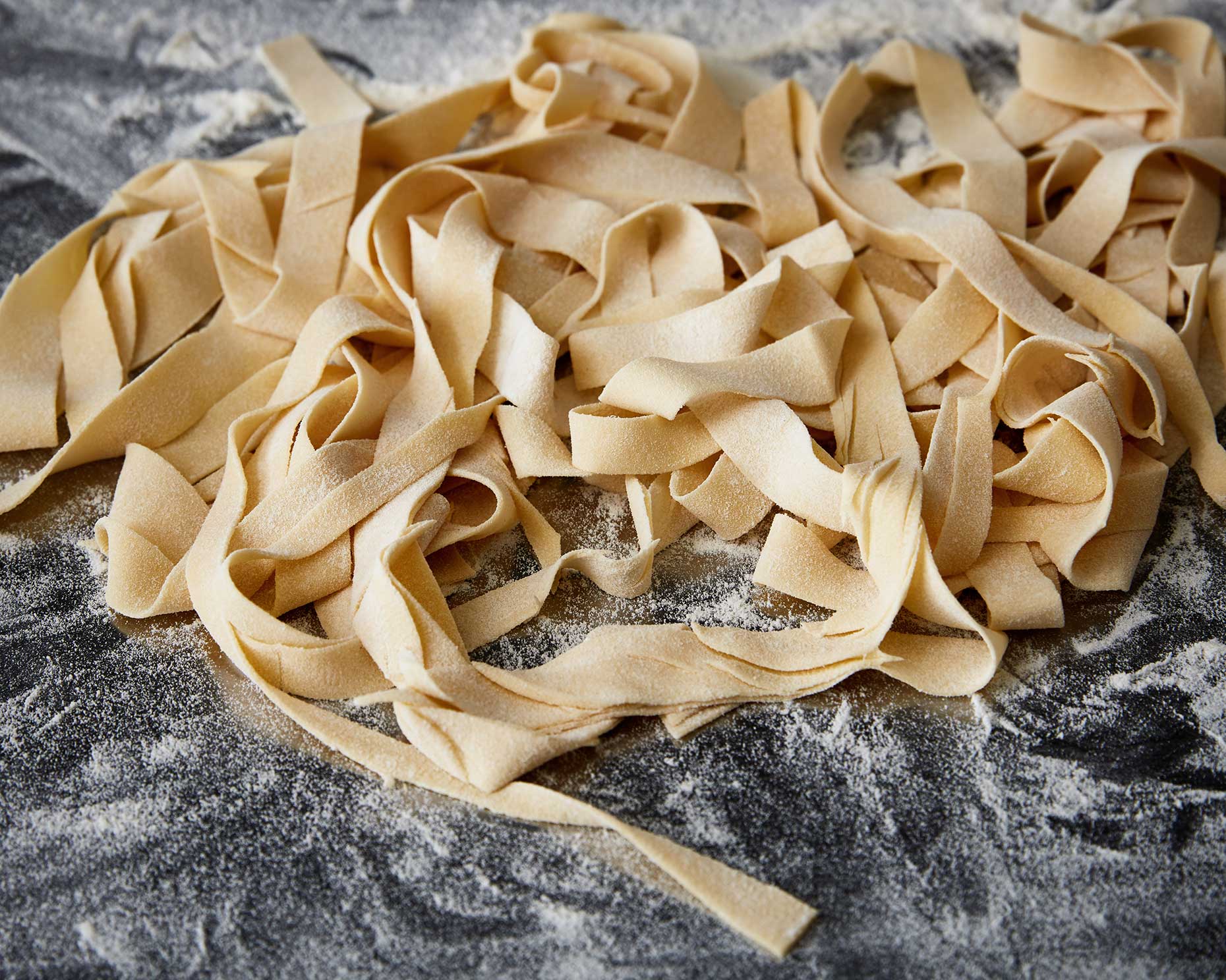 freshly cut pasta strips at a restaurant