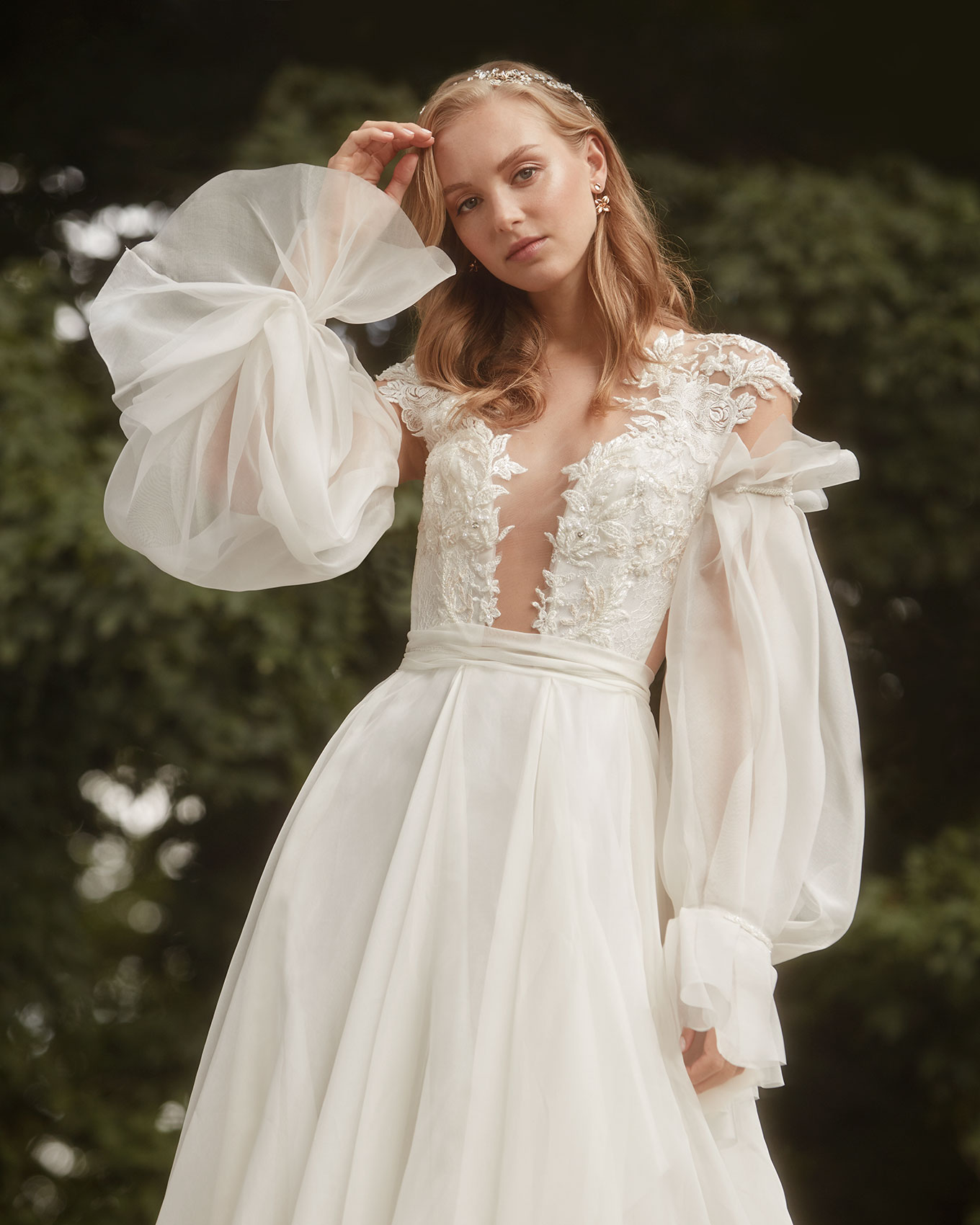 Bridal fashion photograph featuring model in park.